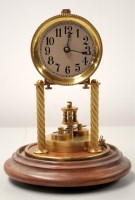 Lot 1581 - A brass torsion clock with silvered dial and...