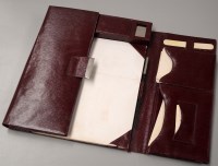 Lot 1585 - A red leather correspondence case with a pair...