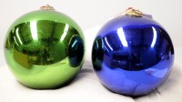 Lot 1605 - Two 19th Century witch balls, one in green,...