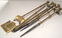 Lot 1616 - A quantity of brass fireside implements,...