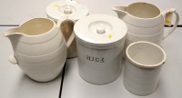 Lot 1657 - Two white ware barrel pattern jugs; together...