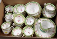 Lot 1679 - A part tea service, hand decorated with rose...