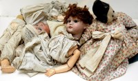 Lot 1720 - A collection of dolls, to include: two bisque...