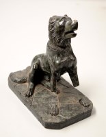 Lot 1731 - A carved green marble study of a seated dog,...