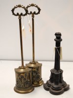 Lot 1733 - A pair of brass door stops with wreath pattern...