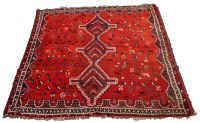 Lot 1794 - A mid/late 20th Century Persian rug, the red...