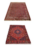 Lot 1801 - A late 20th Century Persian rug with full...