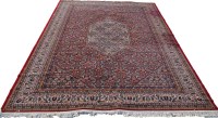 Lot 1803 - A machine-made Persian style carpet, the...