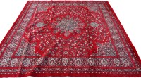 Lot 1813 - A machine-made Persian style rug with floral...