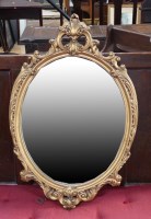 Lot 1818 - A modern gilt frame oval-shaped wall mirror...