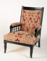 Lot 1822 - A Victorian ebonised lady's open arm chair...