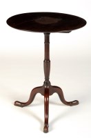 Lot 1826 - A Georgian circular mahogany tip-up-top...