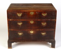 Lot 1876 - An early George III oak chest of three long...