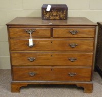 Lot 1883 - A Georgian mahogany chest of two short and...