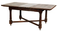 Lot 1894 - A rectangular oak extending dining table with...