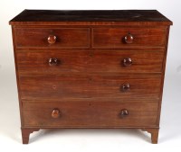 Lot 1899 - A late Georgian mahogany chest of two short...