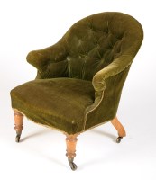 Lot 1900 - A Victorian buttoned back easy chair covered...