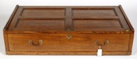 Lot 1907 - A rectangular oak under bed trunk with sliding...