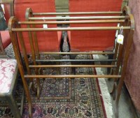 Lot 1910 - A pair of mahogany towel airers raised on...