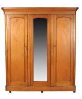 Lot 1924 - A Victorian pine three-door wardrobe, the...