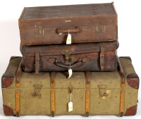 Lot 1944 - A large canvas trunk; a leather suitcase; and...