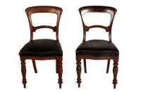 Lot 1961 - A pair of Victorian mahogany balloon-back...