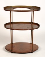 Lot 1989 - An early 20th Century three-tier mahogany oval-...