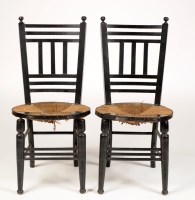 Lot 2001 - A pair of ebonised rush seat occasional chairs,...