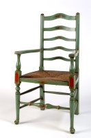 Lot 2012 - A green painted rush seat ladder-back open...