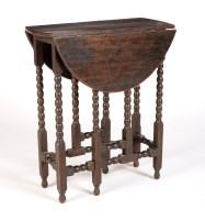 Lot 2016 - A small oak gateleg table with a pair of...