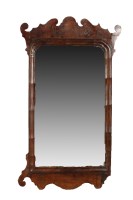 Lot 2039 - A Georgian walnut bevelled wall mirror, with...