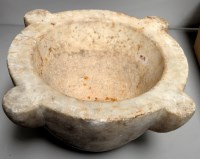 Lot 2059 - A marble mortar with lobed decoration, 17in....