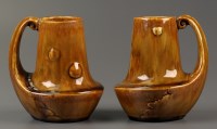 Lot 480 - A pair of Adamesk jugs by Moses J. Adams,...