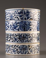Lot 505 - Four blue and white stacking pots, painted in...