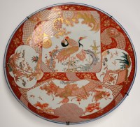 Lot 539 - A large Imari wall plaque, painted with panels...