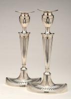 Lot 644 - A pair of Edwardian candlesticks, by...