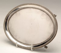 Lot 647 - A George III teapot stand, by Elizabeth Jones,...