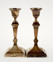 Lot 676 - A pair of Edwardian candlesticks, by Huttons,...