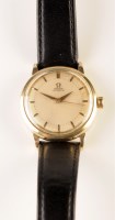 Lot 749 - Omega: a gentleman's gold cased wristwatch,...