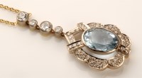 Lot 768 - An aquamarine and diamond pendant, the oval...