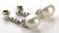 Lot 770 - A pair of pearl and diamond drop earrings,...