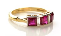 Lot 775 - A ruby and diamond ring, the three princess...