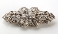 Lot 777 - A diamond brooch, of Art Deco double-clip...