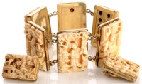 Lot 794 - A Chinese carved ivory bracelet and matching...