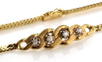 Lot 797 - A 9ct gold and diamond bracelet, the central...