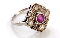 Lot 801 - An Art Deco ruby and diamond cluster ring, in...