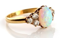 Lot 817 - An opal and diamond ring, the central oval...