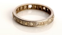 Lot 826 - A diamond eternity ring, set in white metal...