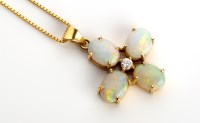 Lot 829 - An opal and diamond cross pattern pendant, the...