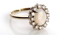 Lot 830 - An opal and diamond cluster ring, the oval...